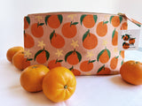 Tangerines on pink. block printed zipper pouch.