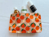 Tangerines on pink. block printed zipper pouch.