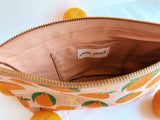 Tangerines on pink. block printed zipper pouch.